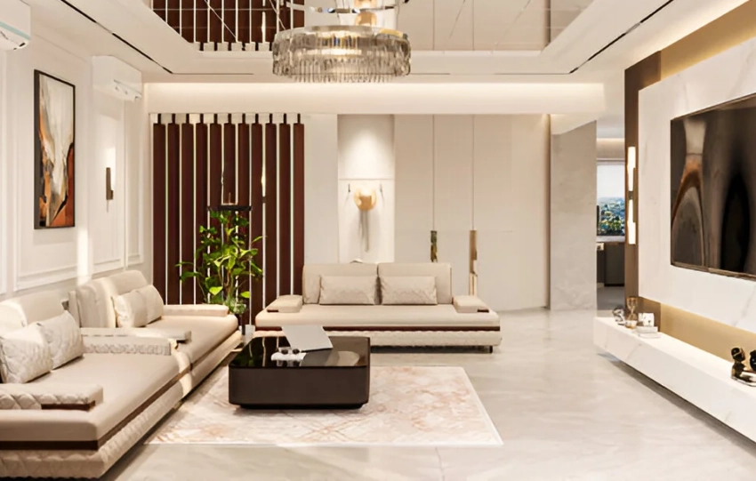 Modern luxury living room with beige sectional sofas, marble flooring, a large wall-mounted TV, elegant chandelier, indoor plant, and contemporary décor in neutral tones.